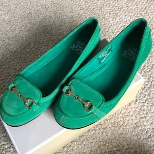 Green loafers with gold buckle